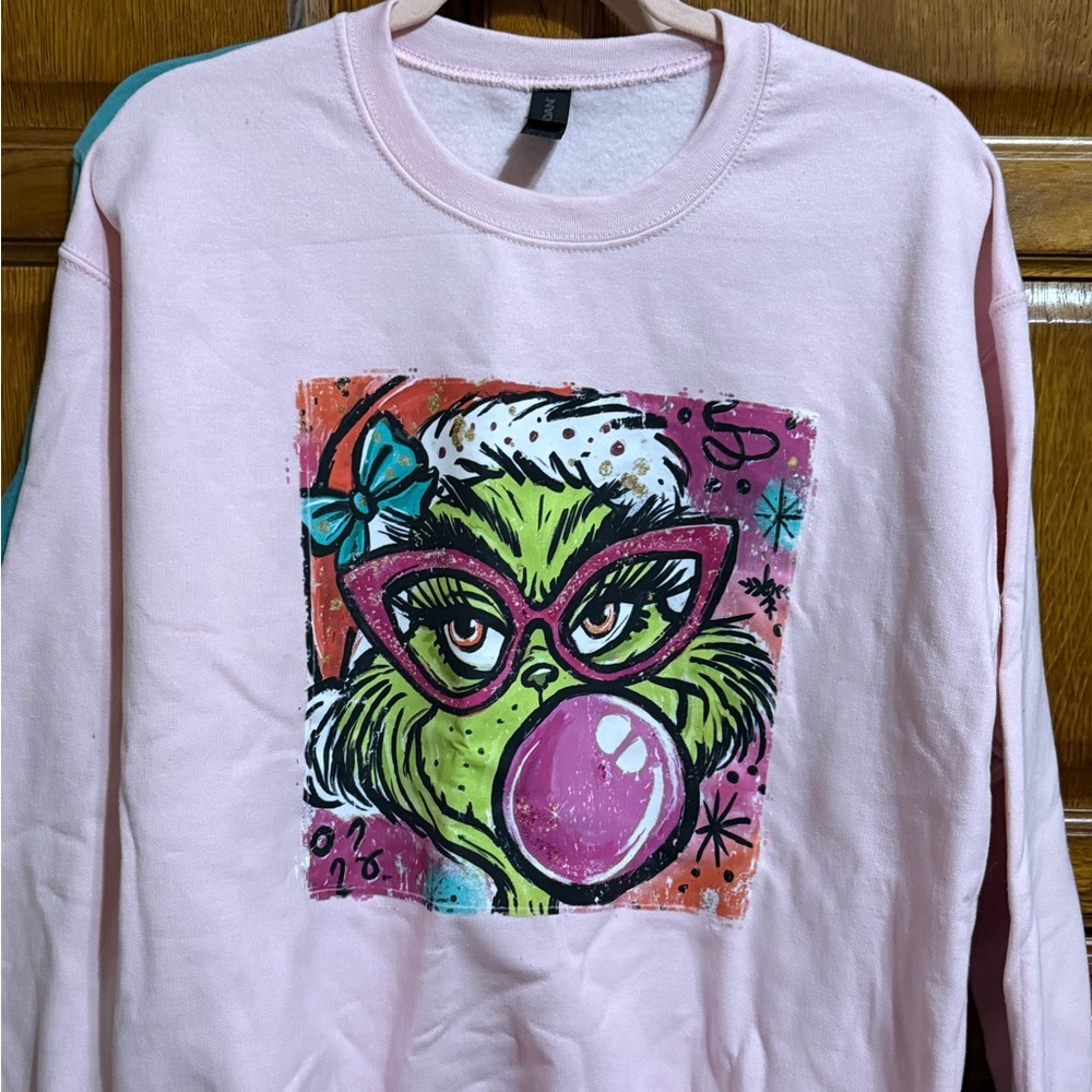 Gildan Pink Heavy Blend Sweatshirt with Grinch Design